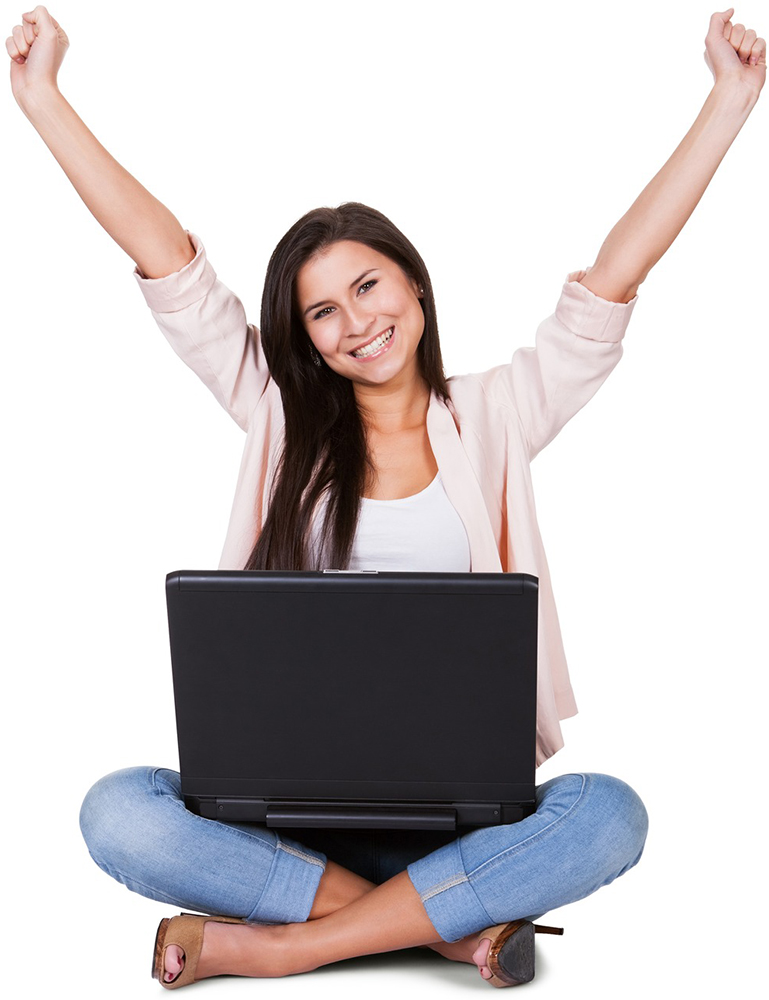 Woman sitting on the floor rejoicing with her laptop balanced on her lap and her arms raised in the air on a white background
